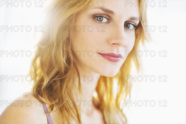 Portrait of young woman, studio shot.