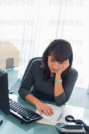 Business woman reading documents.