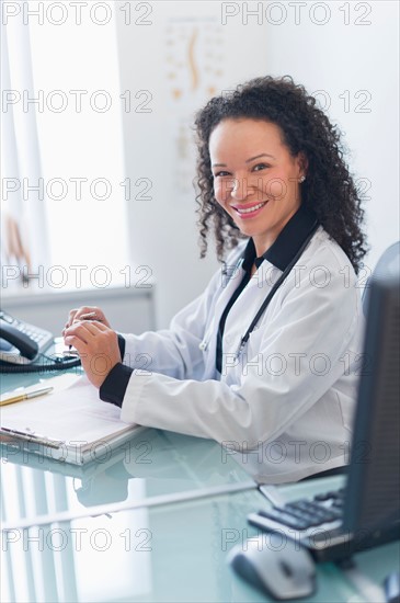 Portrait of female doctor in office.