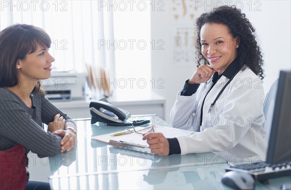 Doctor with patient in office.