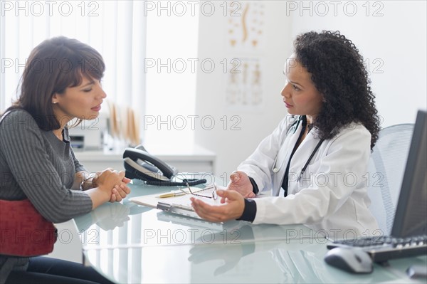 Doctor with patient in office.