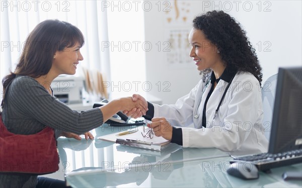 Doctor with patient in office.