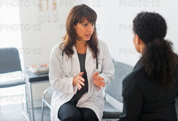 Doctor with patient in office.