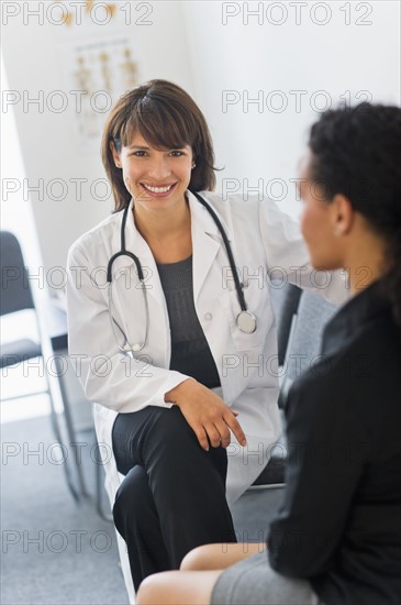 Doctor with patient in office.
