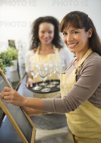 Two female business owners in restaurant.