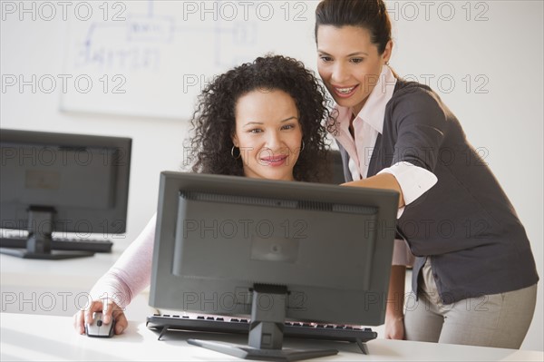 Business women using computer in office.