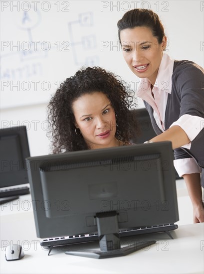 Business women using computer in office.