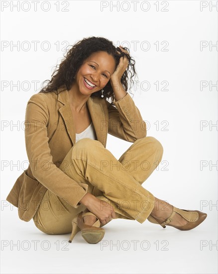 Studio portrait of mid adult woman.