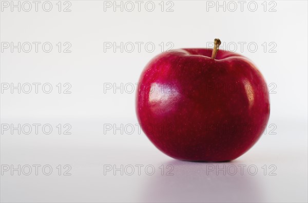 Red apple on white background.