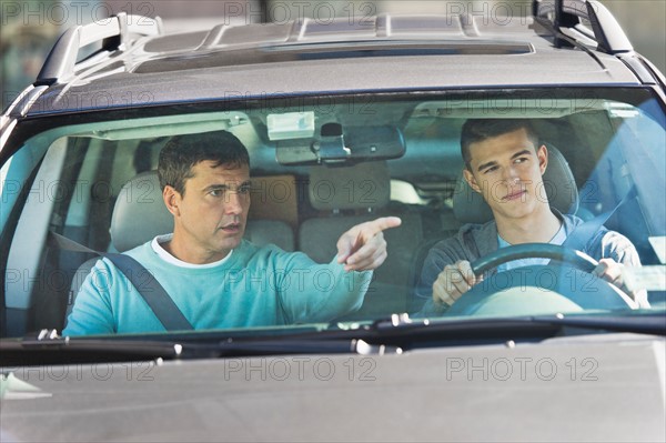 Father with teenage (16-17) son driving.