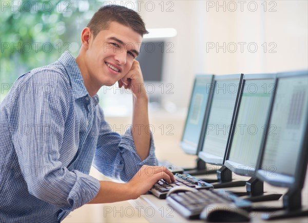 Teenage student (16-17) in computer lab.