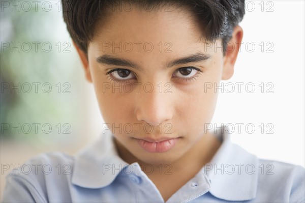 Portrait of angry boy (12-13).