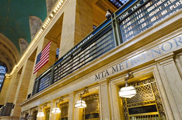 USA, New York State, New York City, Interior of Grand Central Station with American flag.