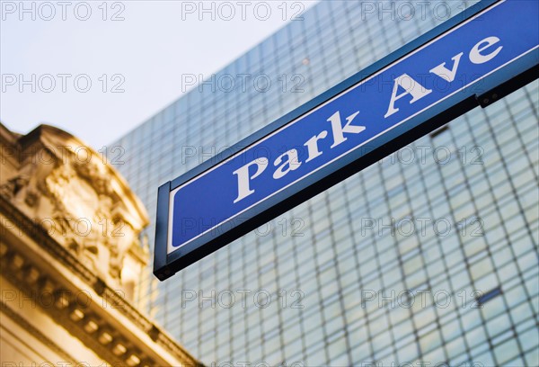 USA, New York State, New York City, Park Avenue road sign with Grand Central Station in background.
