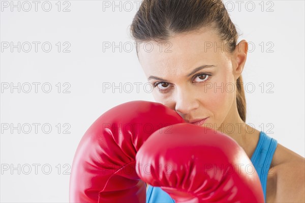 Studio shot of woman boxing.