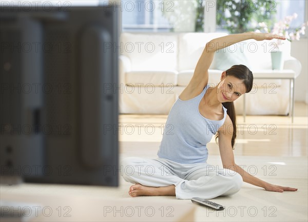 Woman exercising at home.