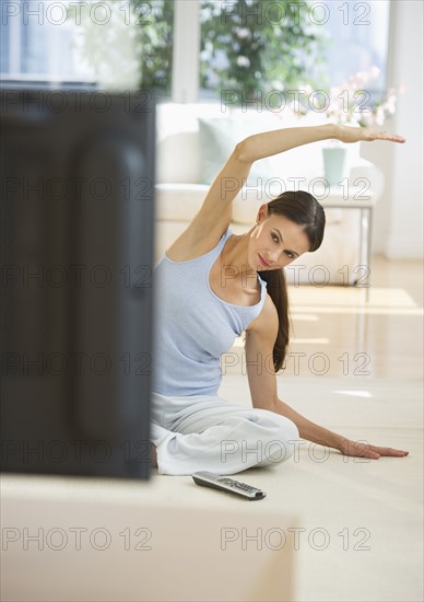 Woman exercising at home.