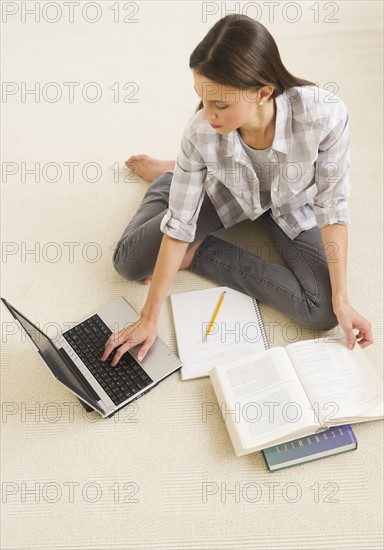 Woman studying at home.