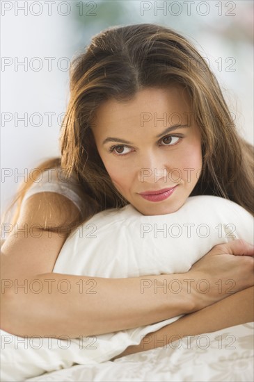 Woman lying on bed.