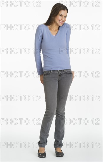 Studio shot of woman biting finger.