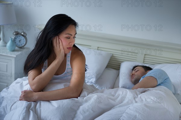 Couple in bed.