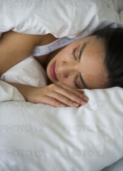 Woman sleeping in bed.