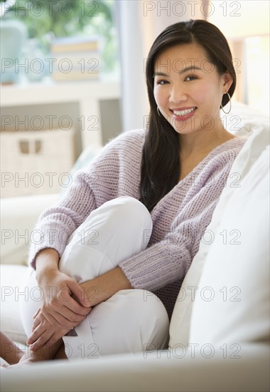 Woman relaxing on sofa.