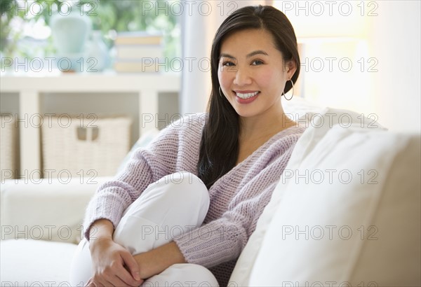 Woman relaxing on sofa.