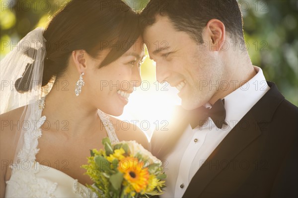 Bride and groom looking at each other.