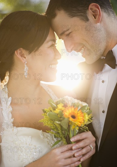 Bride and groom looking at each other.