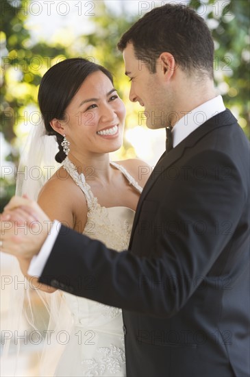 Bride and groom dancing.