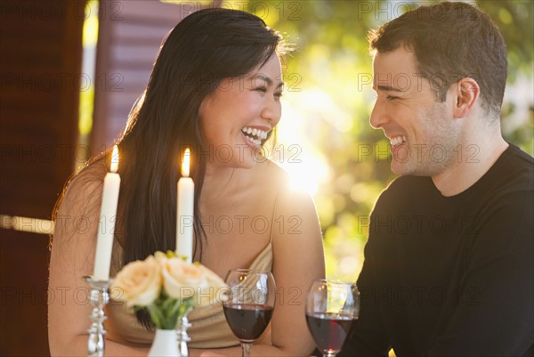 Couple enjoying fine meal in restaurant.