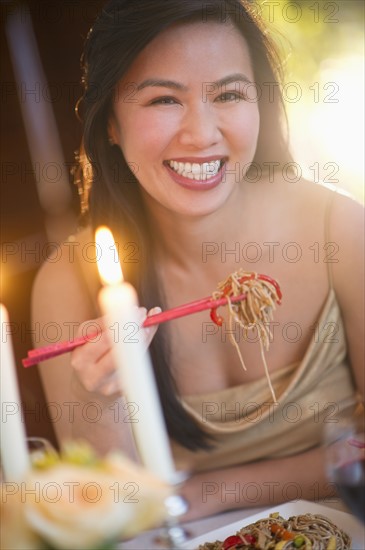 Woman enjoying fine meal in restaurant.