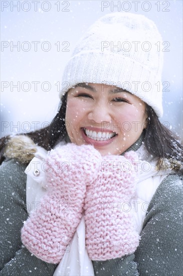 Portrait of happy woman wearing warm clothing.