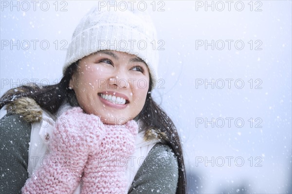 Portrait of happy woman wearing warm clothing.