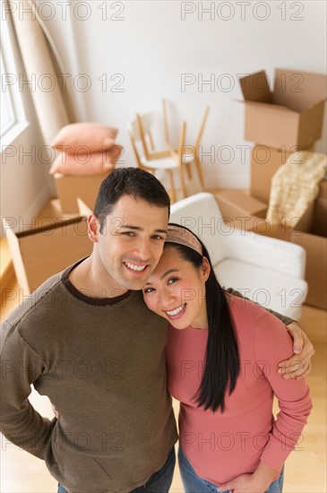 Portrait of couple in new house.