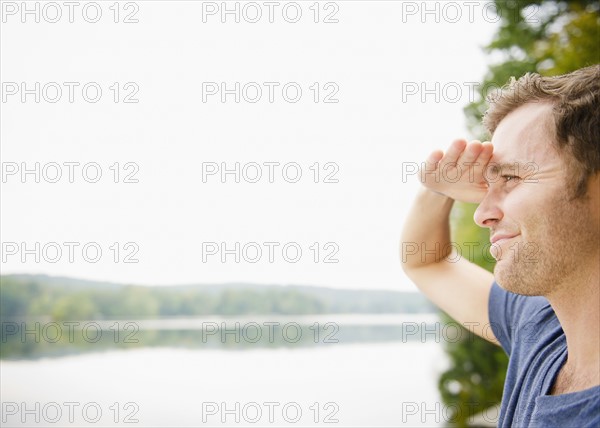 USA, New York, Putnam Valley, Roaring Brook Lake, Close up of man looking at view. Photo : Jamie Grill