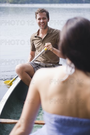 Roaring Brook Lake, Couple in boat on lake. Photo: Jamie Grill