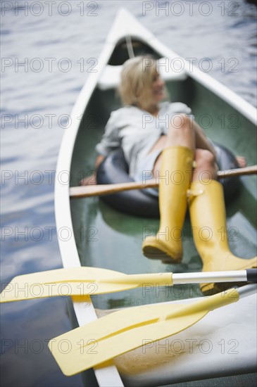 Roaring Brook Lake, Woman sitting in boat. Photo : Jamie Grill