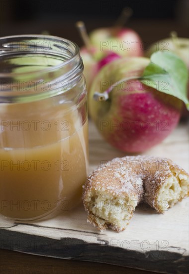 Close up apple cider, donut and apple on table. Photo: Jamie Grill