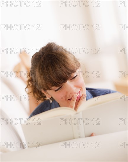 Young woman reading book. Photo: Daniel Grill