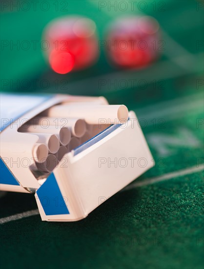 Close up of open cigarette pack on casino table. Photo : Daniel Grill