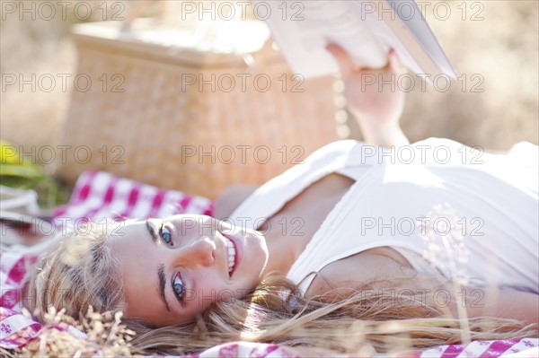 Happy teenage girl (16-17) relaxing outdoors. Photo : Take A Pix Media