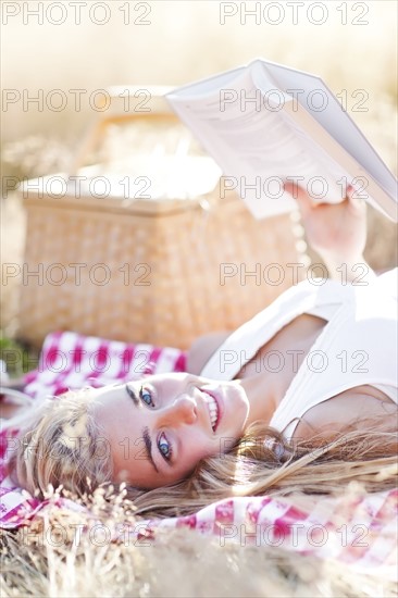 Happy teenage girl (16-17) relaxing outdoors. Photo : Take A Pix Media