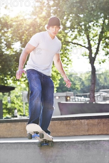 Young man skateboarding. Photo : Take A Pix Media