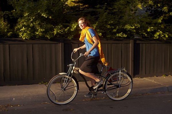 USA, Colorado, Woman riding bike. Photo: John Kelly