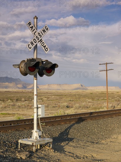 USA, Utah, Desert landscape with railroad crossing. Photo : John Kelly