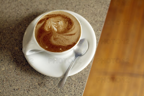 Cup of coffee on table. Photo : John Kelly