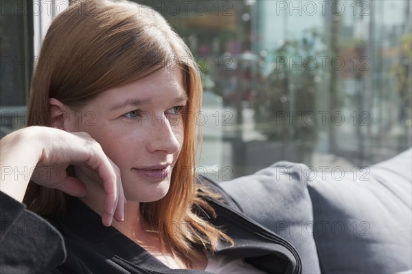 The Netherlands, Amsterdam, Portrait of young businesswoman. Photo : Jan Scherders