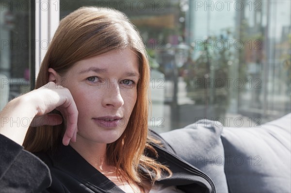 The Netherlands, Amsterdam, Portrait of young businesswoman. Photo : Jan Scherders